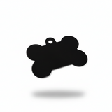 Black bone-shaped pendant on a white background