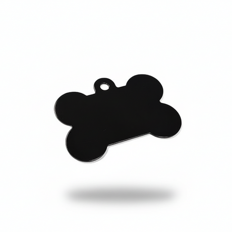 Black bone-shaped pendant on a white background