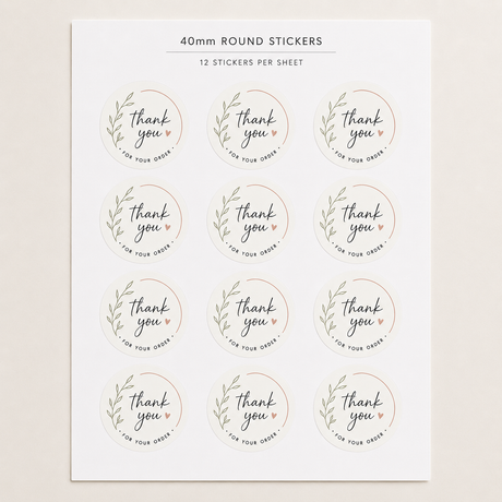 A sheet of round 40mm stickers with a botanical wreath design and the words 'thank you' in script, plus smaller text reading 'FOR YOUR GIFT' and '12 STICKERS PER SHEET' at the top.