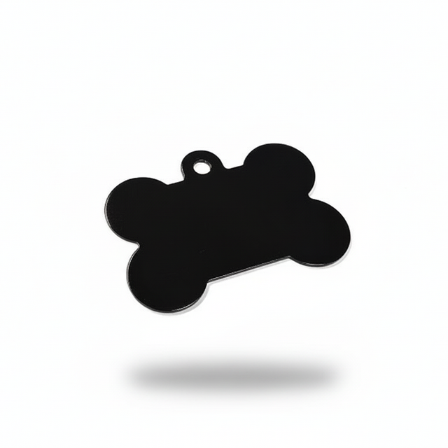 Black bone-shaped pendant on a white background