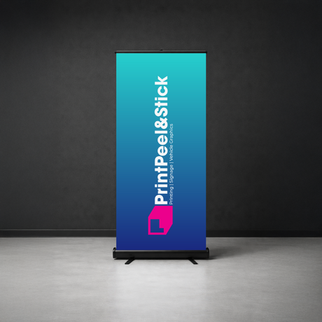 Roll-up banner with 'PrintPeel&Stick' branding on a dark background