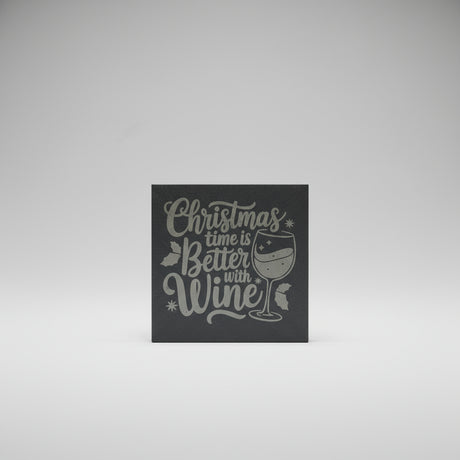Decorative sign with 'Christmas time is better with wine' text on a dark background