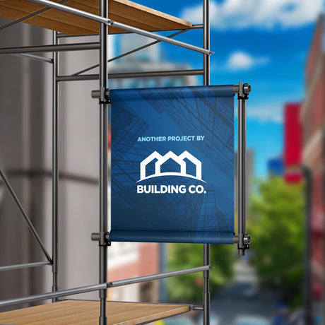 Scaffolding with a blue banner displaying 'Another Project by Building Co.' against a blurred cityscape.